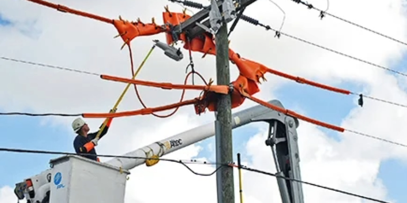 an FPL lineman on a bucket installing a recloser opens case study on eighty thousand reclosers combat nations toughest weather