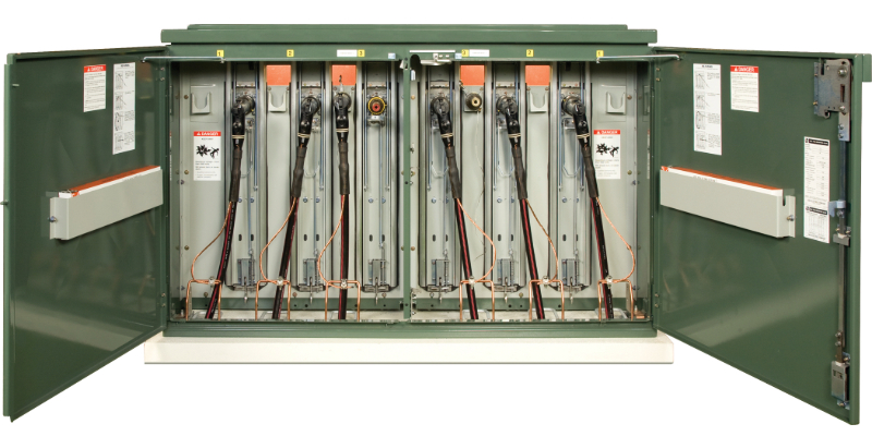Green Remote Supervisory PME unit with its fuse-side doors swung open. Some of the unit’s six elbow connections are connected to bushings while others hang in the storage compartments beside the bushings.