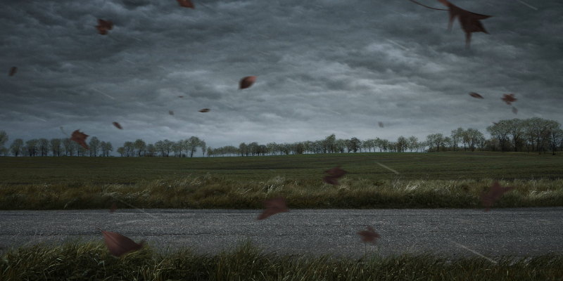 storm over a parking lot and grassy field storm over a parking lot and grassy field