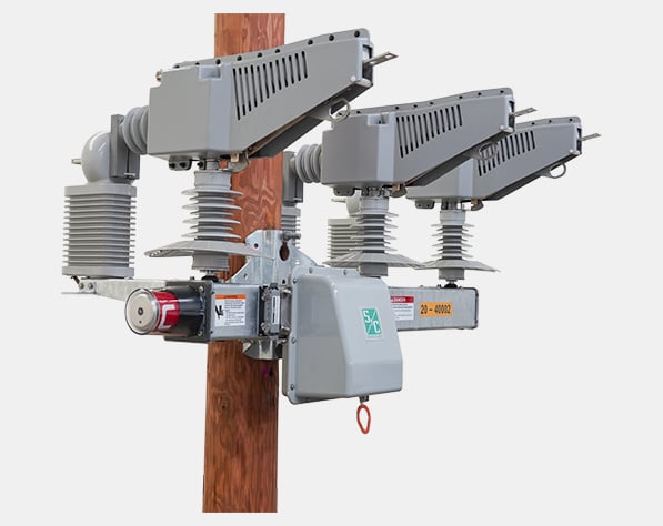 right side profile of a three-pole operated environmentally friendly switching system that uses a vacuum interrupting medium for overhead distributed automation environmentally friendly switching system, compact-crossarm upright, compact-crossarm upright three-pole operated environmentally friendly switching system that uses a vacuum interrupting medium for overhead distributed automation