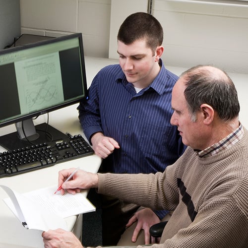 Analytical Studies, team members working together, working in front of a computer, viewing a synode on computer, synode