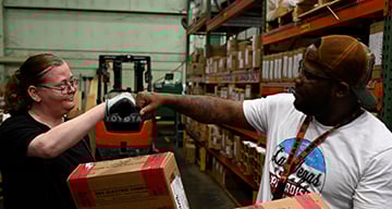 S&C team members bumping fists S&C team members bumping fists